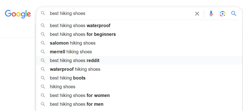 enter your seed phrases like your product category, the primary purpose of your product, or the service you offer into Google’s search bar and add a commercial intent modifier example 1